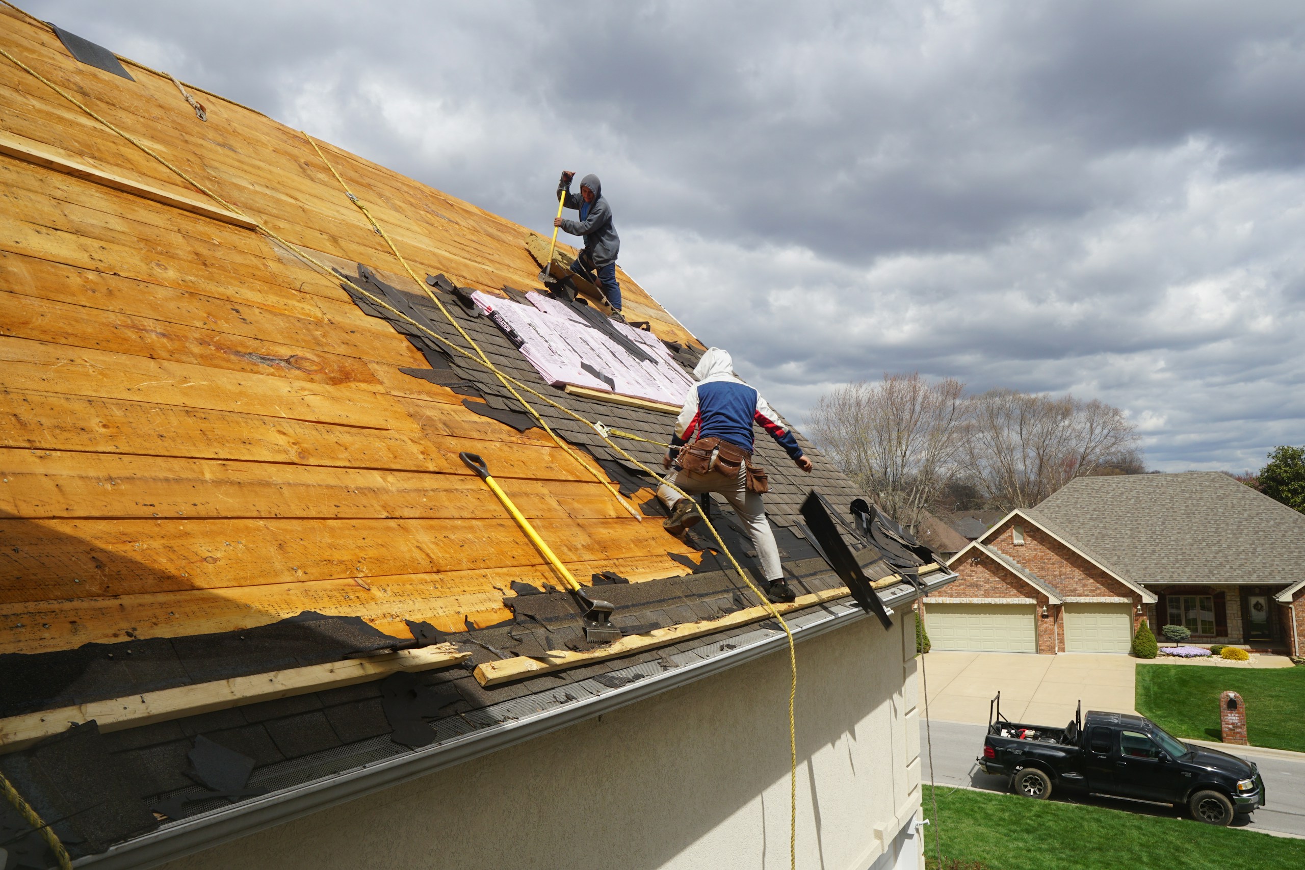 Photo by Robert Linder a couple of men working on a roof